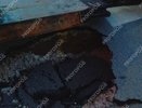 Коммунальщики выяснили причину провала асфальта под авто на улице Владимира